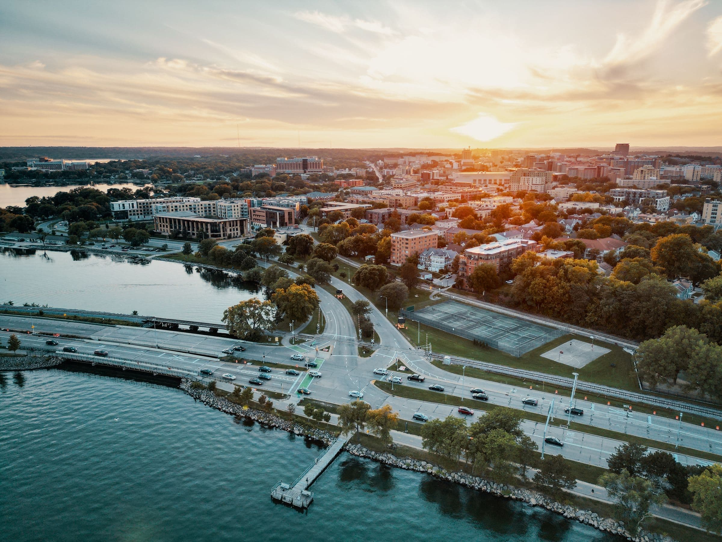 Aerial view of a Wisconsin lakeside city with bridges at sunset
